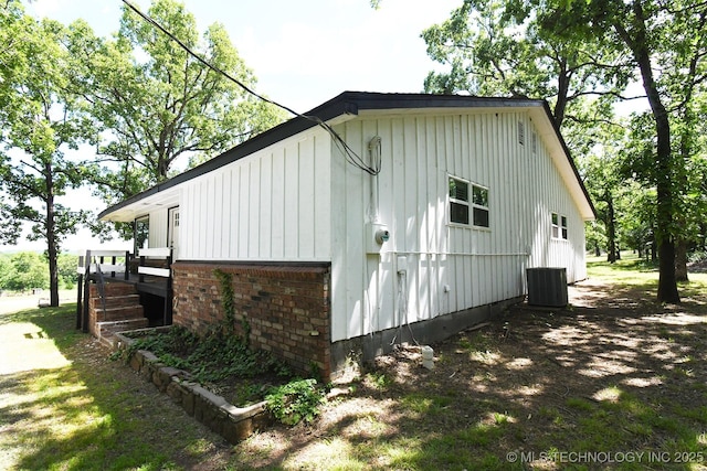 96358 S 4531, Vian, OK 74962 - view of home's exterior with board and batten siding and central air condition unit
