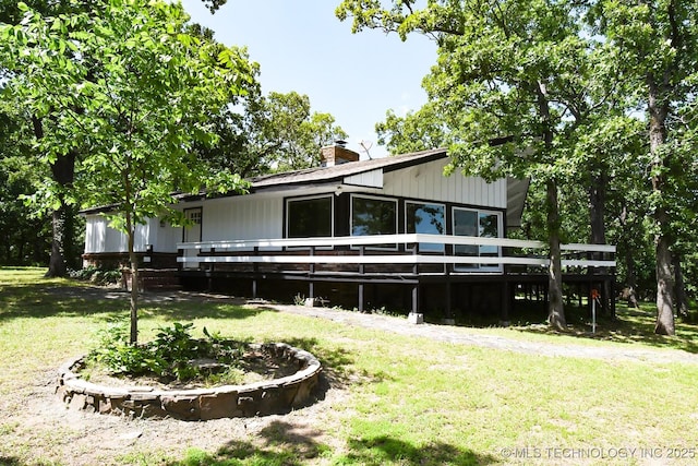 96358 S 4531, Vian, OK 74962 - rear view of property featuring a yard, a wooden deck, and a chimney