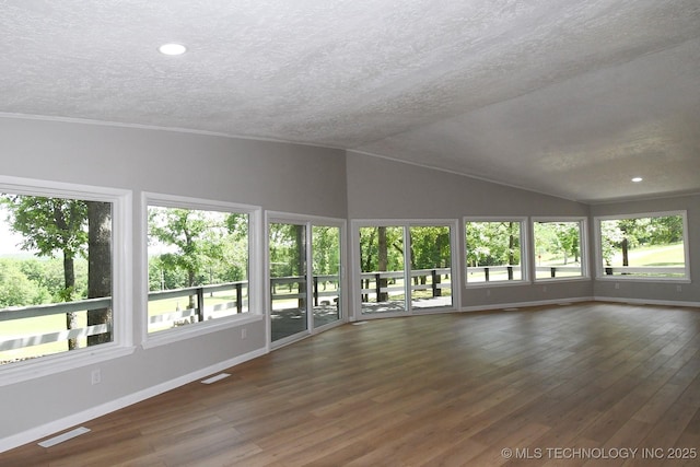 96358 S 4531, Vian, OK 74962 - unfurnished living room featuring a textured ceiling, vaulted ceiling, baseboards, wood finished floors, and recessed lighting
