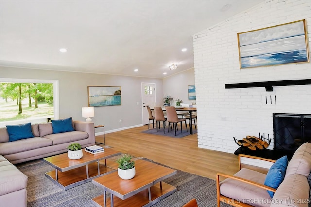96358 S 4531, Vian, OK 74962 - living area featuring plenty of natural light, light wood-style floors, recessed lighting, baseboards, and a brick fireplace