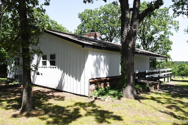 96358 S 4531, Vian, OK 74962 - view of side of property featuring a chimney and a lawn