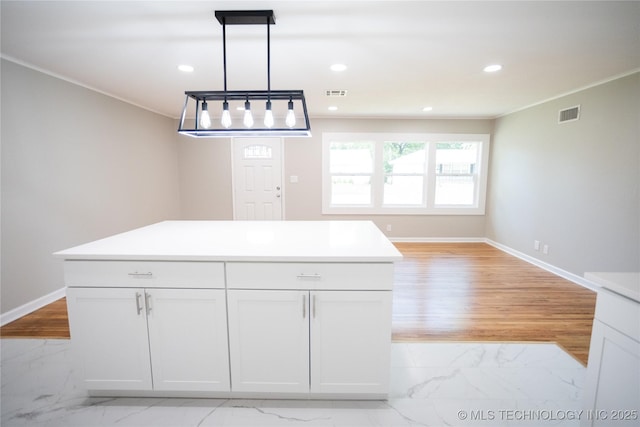 4024 E 25th St, Tulsa, OK 74114 - kitchen featuring light marble finish flooring, baseboards, recessed lighting, hanging light fixtures, and light countertops