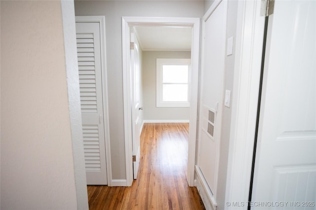 4024 E 25th St, Tulsa, OK 74114 - corridor with ornamental molding, wood finished floors, and baseboards