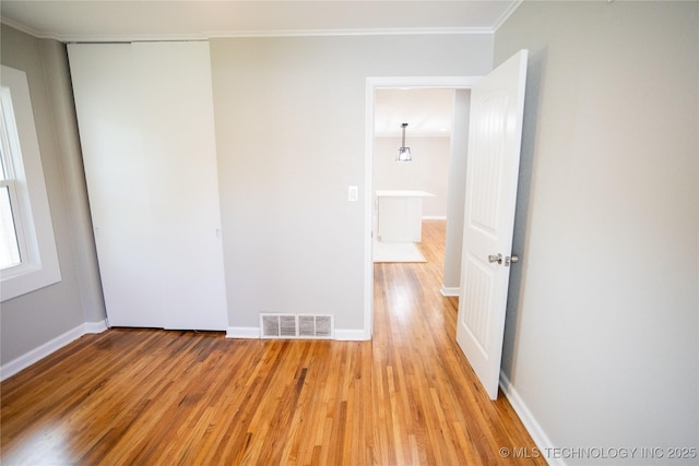 4024 E 25th St, Tulsa, OK 74114 - empty room with light wood-style flooring, ornamental molding, and baseboards