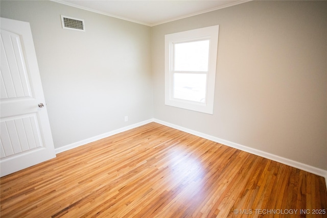 4024 E 25th St, Tulsa, OK 74114 - empty room with crown molding, wood finished floors, and baseboards