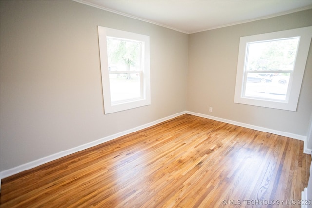 4024 E 25th St, Tulsa, OK 74114 - unfurnished room featuring crown molding, wood finished floors, and baseboards