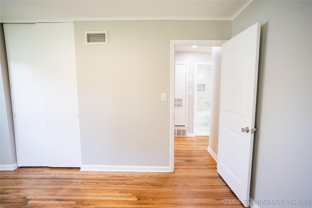 4024 E 25th St, Tulsa, OK 74114 - empty room with crown molding, light wood-style floors, and baseboards