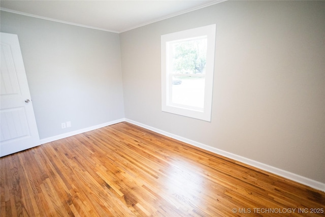 4024 E 25th St, Tulsa, OK 74114 - unfurnished room featuring crown molding, light wood-style flooring, and baseboards