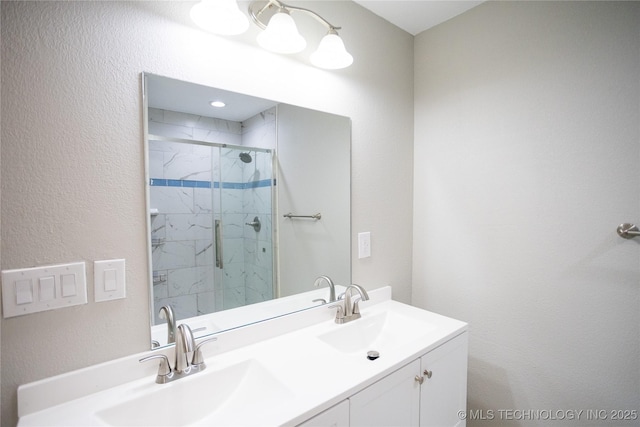 4024 E 25th St, Tulsa, OK 74114 - full bathroom with a marble finish shower, a textured wall, and double vanity