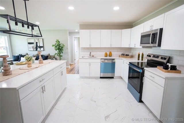 4024 E 25th St, Tulsa, OK 74114 - kitchen with appliances with stainless steel finishes, a sink, recessed lighting, decorative backsplash, and white cabinets