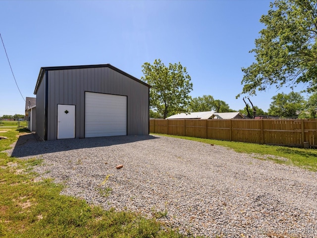 241 NE Debell Ave, Bartlesville, OK 74006 - detached garage featuring driveway