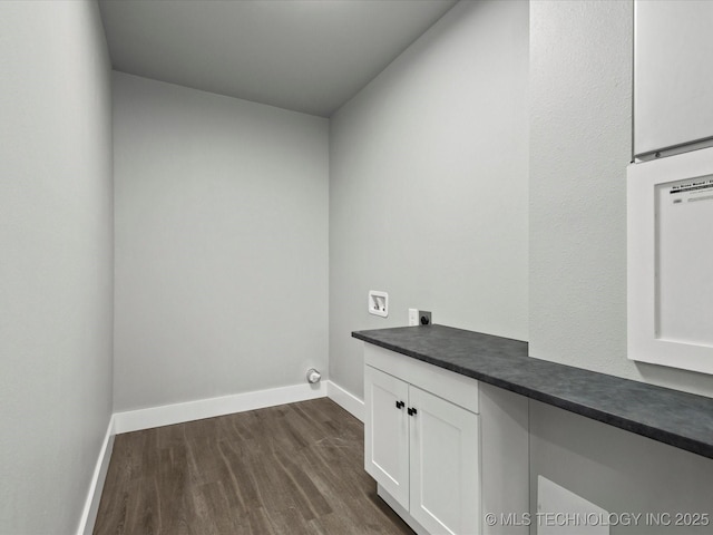 241 NE Debell Ave, Bartlesville, OK 74006 - laundry room featuring hookup for an electric dryer, washer hookup, dark wood-style flooring, baseboards, and cabinet space