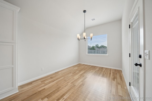 1305 N Dogwood Ave, Broken Arrow, OK 74012 - empty room with a chandelier, light wood-style flooring, and baseboards
