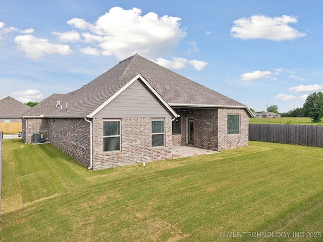 1305 N Dogwood Ave, Broken Arrow, OK 74012 - back of property with central air condition unit, brick siding, a patio, and roof with shingles