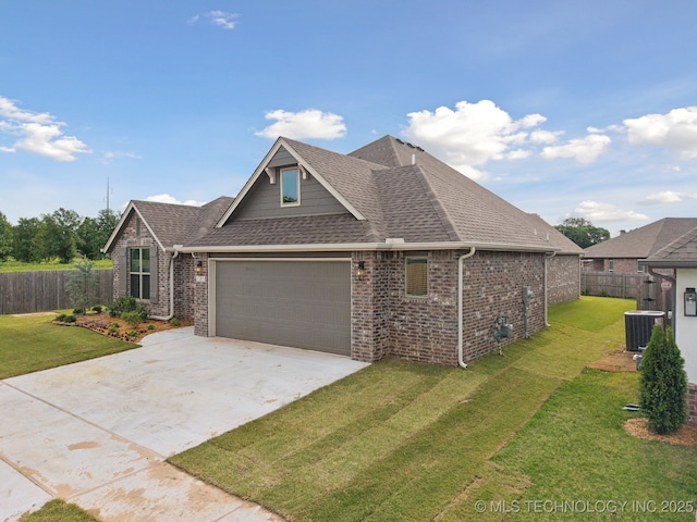 1305 N Dogwood Ave, Broken Arrow, OK 74012 - view of front facade with brick siding, concrete driveway, an attached garage, roof with shingles, and central AC unit