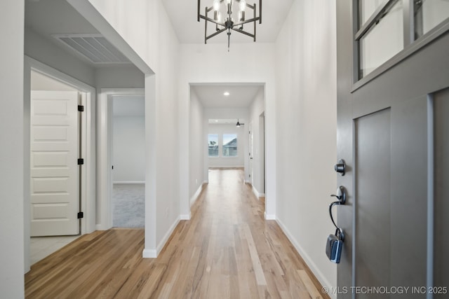 1305 N Dogwood Ave, Broken Arrow, OK 74012 - entryway featuring light wood finished floors, a chandelier, and baseboards