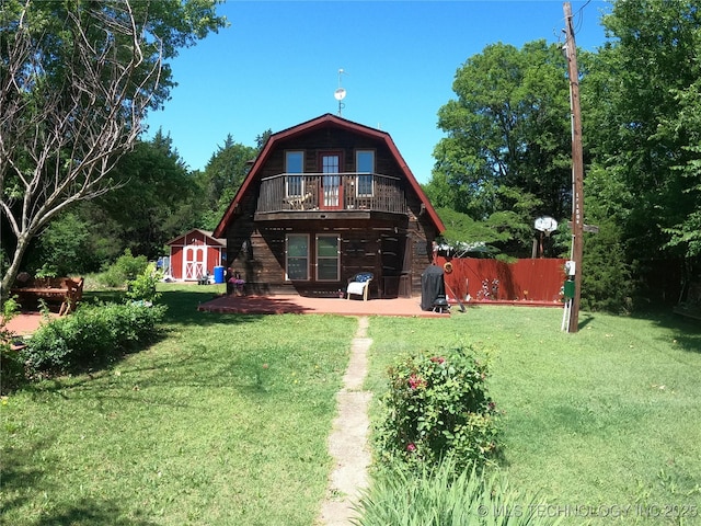 808 N Norfolk Rd, Yale, OK 74085 - rear view of house with a gambrel roof and a balcony