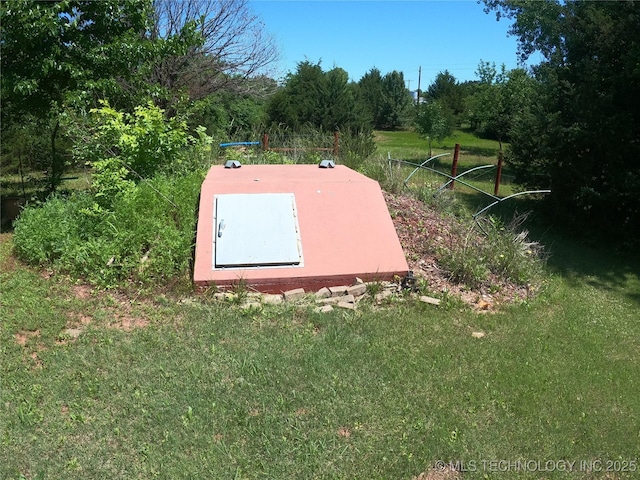 808 N Norfolk Rd, Yale, OK 74085 - entry to storm shelter with a lawn