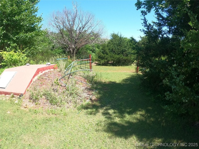 808 N Norfolk Rd, Yale, OK 74085 - entry to storm shelter featuring a lawn
