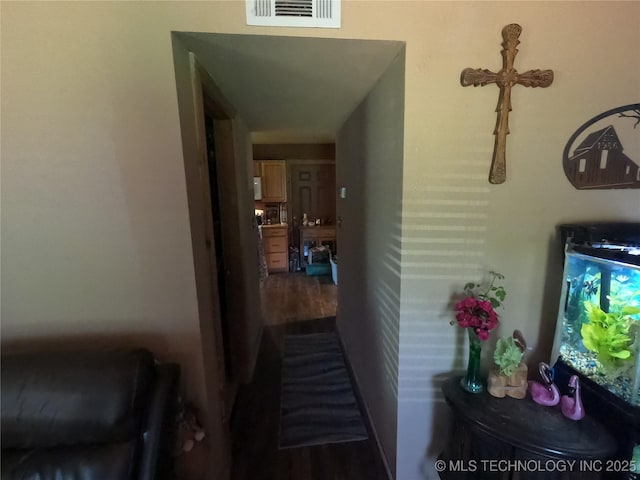 808 N Norfolk Rd, Yale, OK 74085 - hallway featuring dark wood-style flooring
