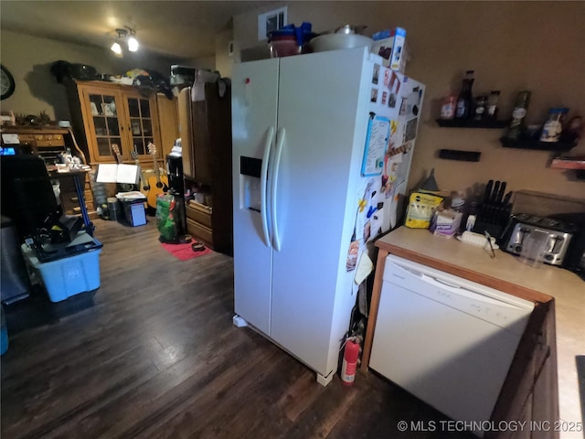 808 N Norfolk Rd, Yale, OK 74085 - kitchen featuring white appliances, dark wood-style floors, and light countertops