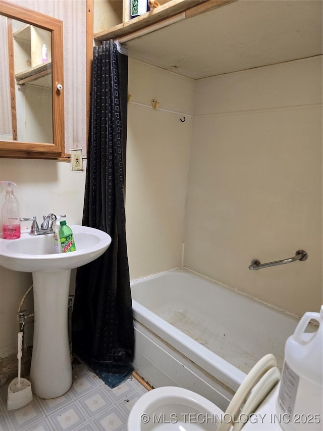 360 N 5th St, Fairfax, OK 74637 - bathroom with shower / bath combo, tile patterned floors, and a sink