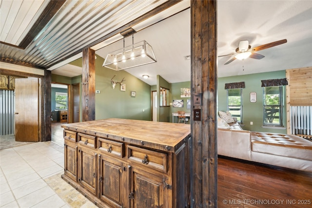1202 S Oak Grove Rd, Cushing, OK 74023 - kitchen with wooden counters, a ceiling fan, pendant lighting, open floor plan, and light tile patterned floors