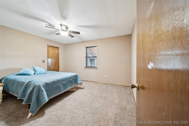 1202 S Oak Grove Rd, Cushing, OK 74023 - bedroom featuring carpet flooring, baseboards, a textured ceiling, and a ceiling fan