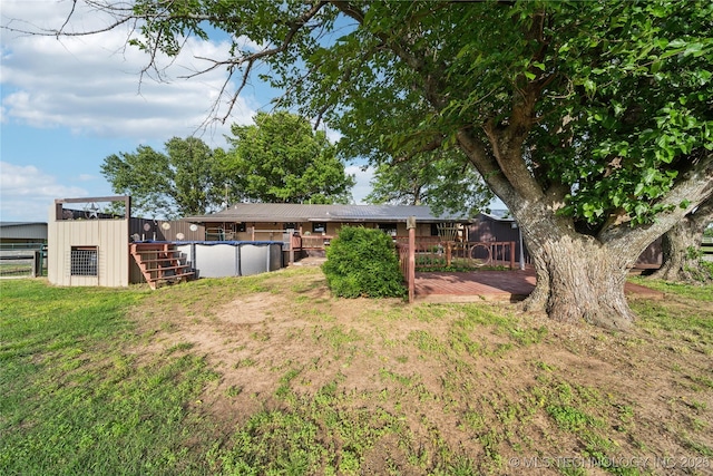 1202 S Oak Grove Rd, Cushing, OK 74023 - view of yard featuring a covered pool and a wooden deck