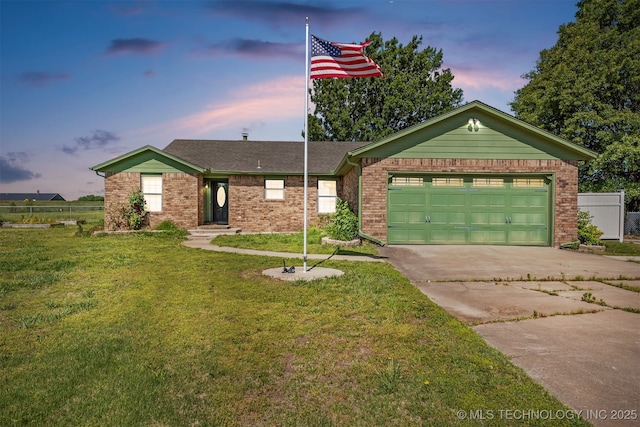 18268 S 79th E Ave, Bixby, OK 74008 - view of front of house featuring driveway, a yard, a garage, and brick siding
