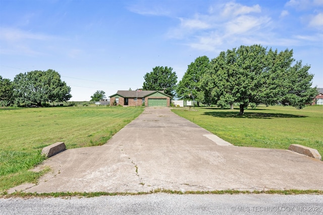 18268 S 79th E Ave, Bixby, OK 74008 - view of front of house with a front lawn, a garage, and concrete driveway