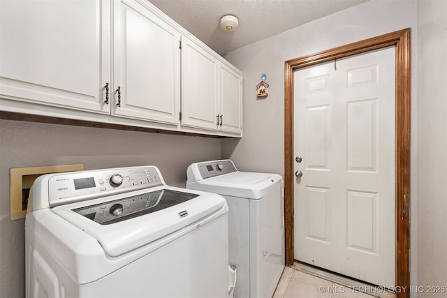 18268 S 79th E Ave, Bixby, OK 74008 - washroom with cabinet space, washing machine and clothes dryer, and light tile patterned floors