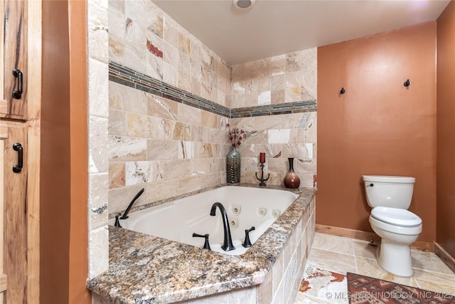 29898 S 566th Rd Unit 422, Afton, OK 74331 - bathroom featuring toilet, a whirlpool tub, and baseboards
