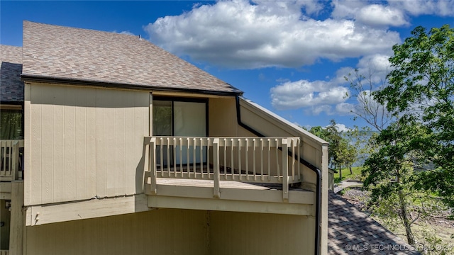 29898 S 566th Rd Unit 422, Afton, OK 74331 - view of home's exterior featuring a balcony and roof with shingles