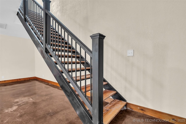 2382 Cheek, Lone Grove, OK 73443 - stairway featuring baseboards and finished concrete floors