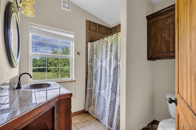2382 Cheek, Lone Grove, OK 73443 - full bath with lofted ceiling, toilet, vanity, a tile shower, and tile patterned floors