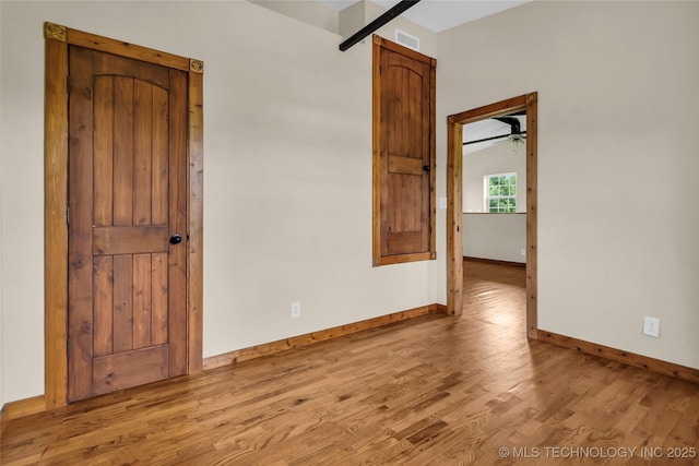 2382 Cheek, Lone Grove, OK 73443 - unfurnished room with wood finished floors, baseboards, and a ceiling fan