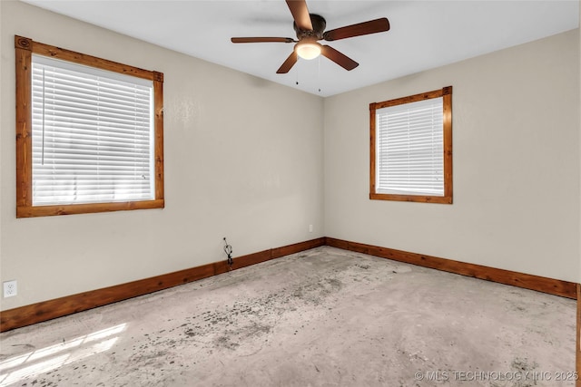 2382 Cheek, Lone Grove, OK 73443 - spare room featuring baseboards, concrete flooring, and a ceiling fan