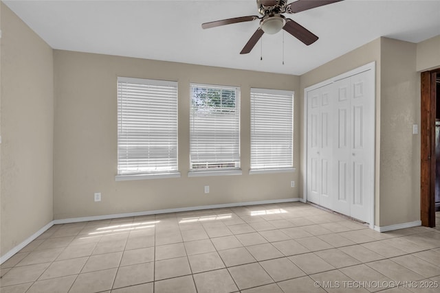 2382 Cheek, Lone Grove, OK 73443 - unfurnished bedroom featuring light tile patterned floors, a closet, and baseboards