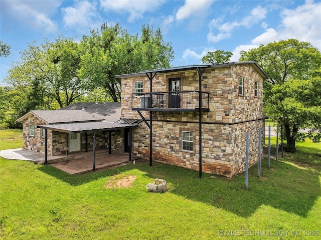 2382 Cheek, Lone Grove, OK 73443 - rear view of house with a balcony, stone siding, and a patio