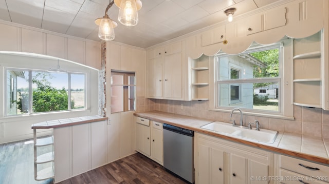 7941 N 433rd Rd, Adair, OK 74330 - kitchen with stainless steel dishwasher, tile countertops, open shelves, a sink, and tasteful backsplash