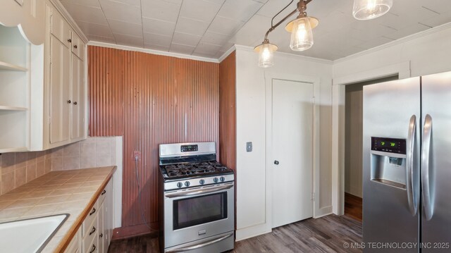 7941 N 433rd Rd, Adair, OK 74330 - kitchen featuring stainless steel appliances, tile countertops, dark wood finished floors, backsplash, and crown molding