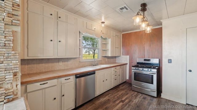 7941 N 433rd Rd, Adair, OK 74330 - kitchen featuring stainless steel appliances, tile counters, a sink, ornamental molding, and tasteful backsplash