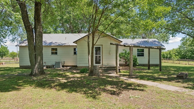 7941 N 433rd Rd, Adair, OK 74330 - back of property featuring cooling unit and metal roof
