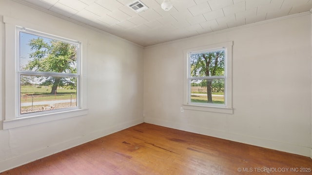 7941 N 433rd Rd, Adair, OK 74330 - unfurnished room with crown molding, wood finished floors, and baseboards
