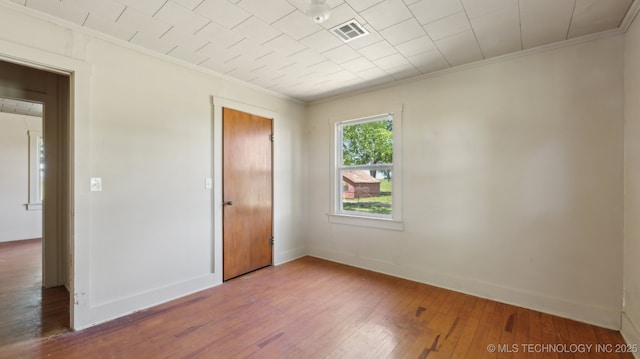 7941 N 433rd Rd, Adair, OK 74330 - unfurnished room with ornamental molding, wood-type flooring, and baseboards