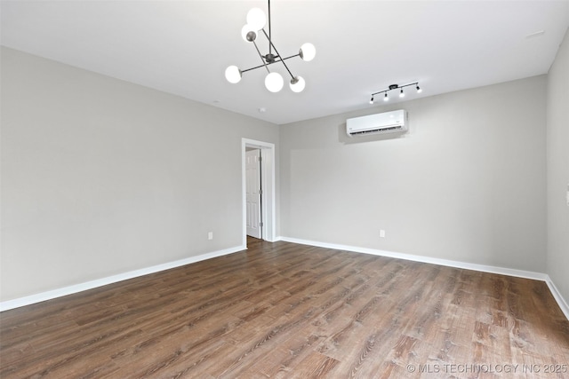 1550 E Apache St N, Tulsa, OK 74106 - empty room featuring a wall mounted air conditioner, a chandelier, wood finished floors, and baseboards