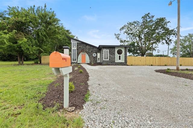 1550 E Apache St N, Tulsa, OK 74106 - view of front facade featuring stone siding