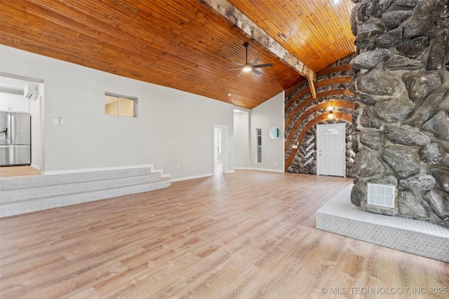 1550 E Apache St N, Tulsa, OK 74106 - unfurnished living room featuring a ceiling fan, stairs, light wood-style floors, wood ceiling with exposed beams, and baseboards