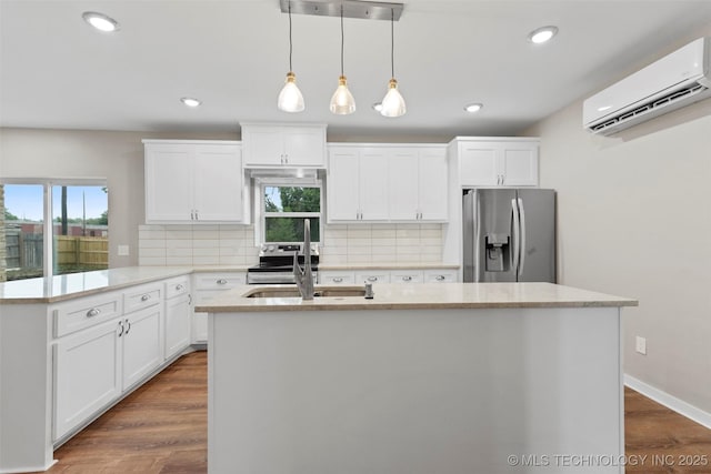 1550 E Apache St N, Tulsa, OK 74106 - kitchen featuring stainless steel fridge, a wall mounted AC, a sink, plenty of natural light, and recessed lighting